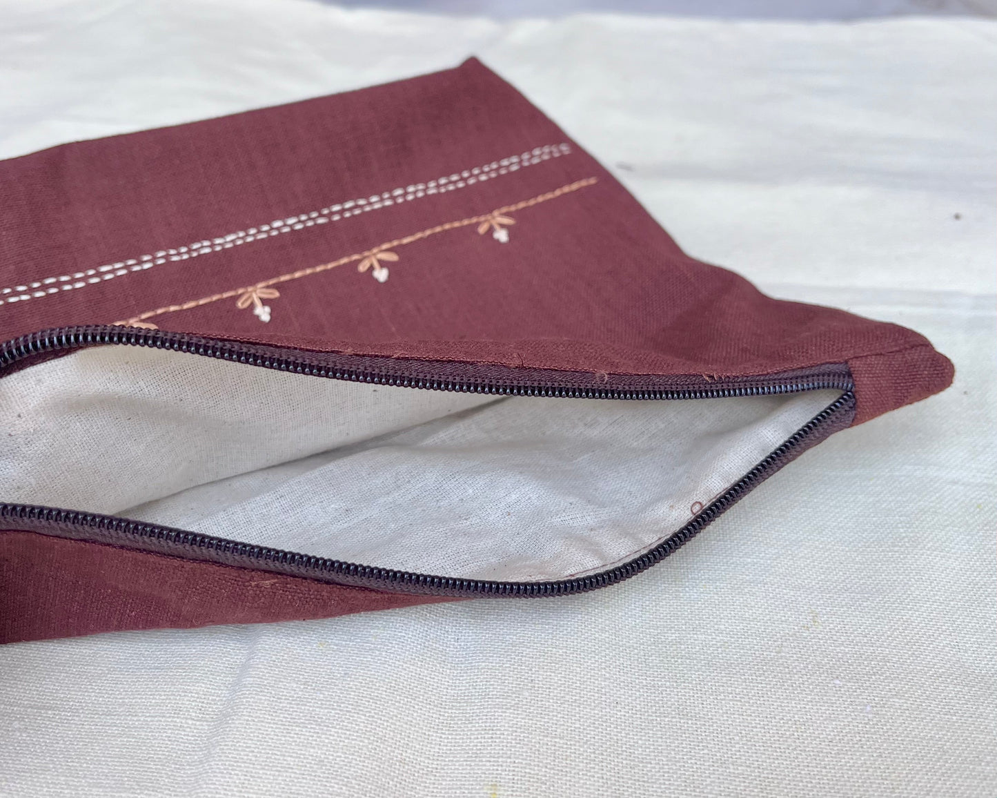 Whispering Sprigs Embroidered Pouch: Elegant Wine Stitch Travel Accessory